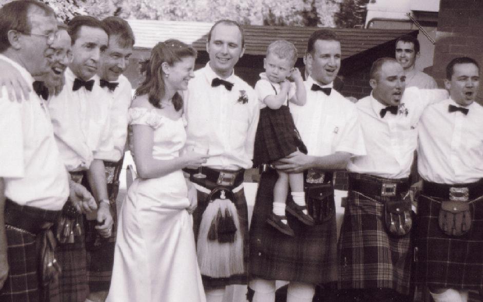 [Boys_in_kilts_and_Carrie.JPG]