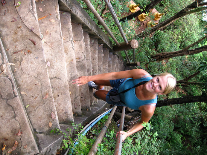 Climbing stairs to get to a temple at the top of a mountain.