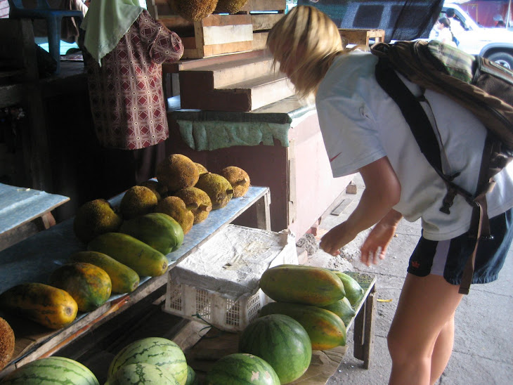 Arielle picking out the perfect Papya