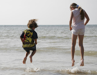 Kids jumping the huge waves at Nai Yang Beach :)