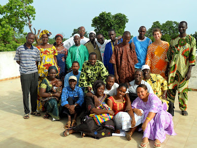 Volunteers and staff, including 16 supervisors, gather to discuss the volunteer program at the office in Kolda, located in southern Senegal.
