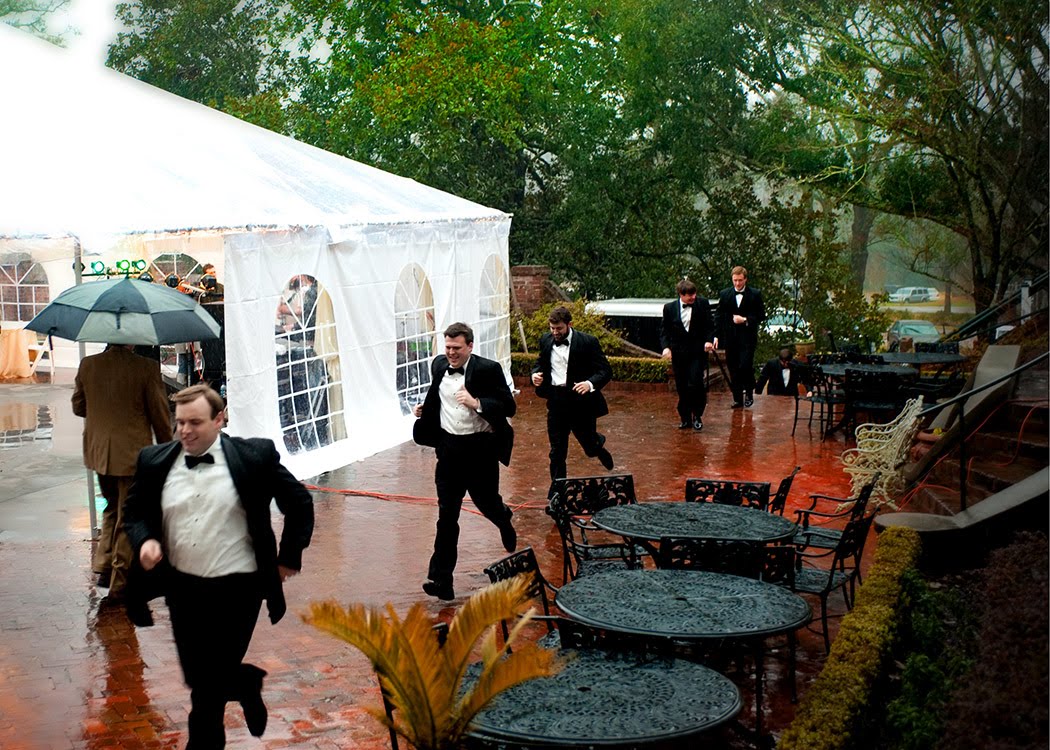 Brian and the groomsmen run through the rain to get to the wedding!
