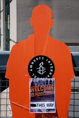 Welcome to Guantanamo sign in Cuernavaca Park - Amnesty