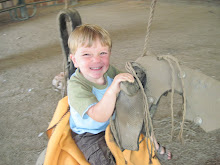 Riding the horse swing in Grandmama's barn