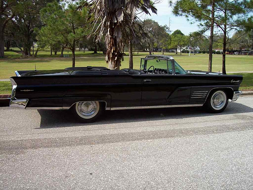 Black 1965 Lincoln Continental with suicide doors, � la Entourage.