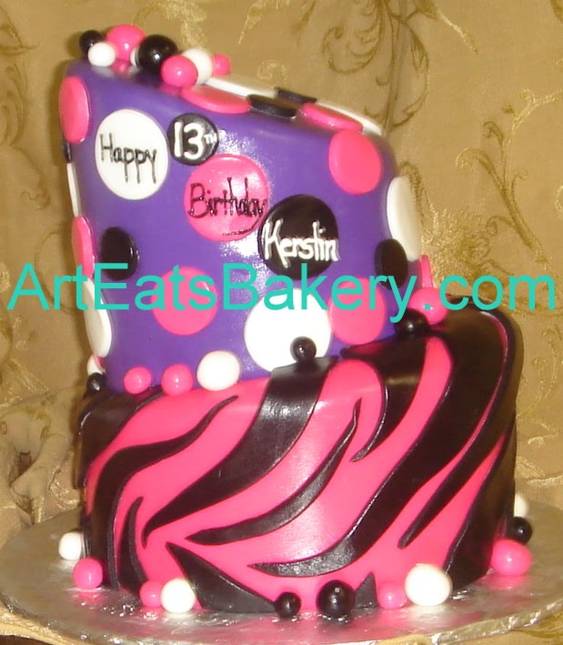  13th birthday cake. The top tier is polka dots and the bottom is zebra 
