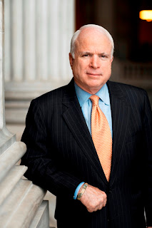 McCain posing in front of the nation's capitol building