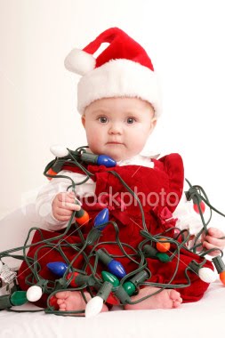 [ist2_1012317-baby-tangled-in-christmas-lights.jpg]