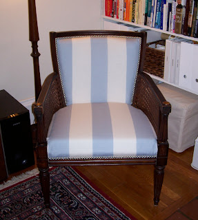white striped fabric chair with brushed nickel nail head trim detail