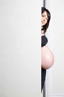pregnant woman doing peekaboo