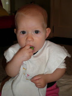 baby eating peas