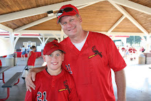 Logan posing with his Dad after playing baseball in Southaven.