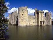 . from its battlements that stand reflected in the moat below. (bodiam castle and moat east sussex england)