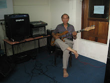 Mr Harry Chew on the bass guitar