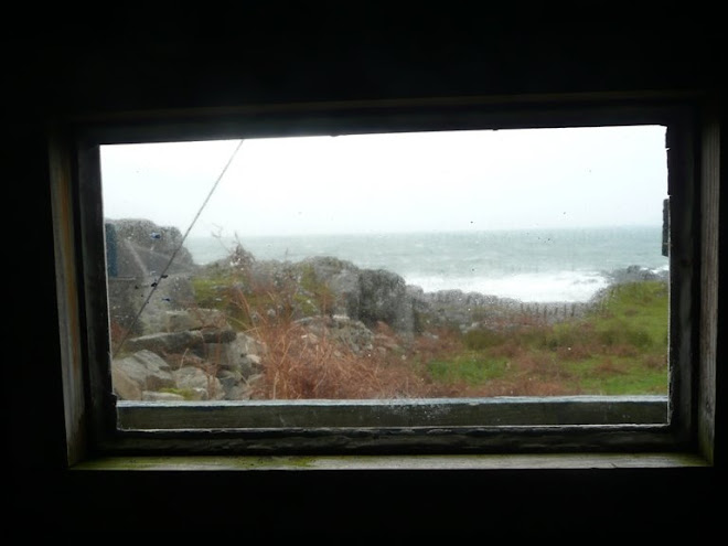 View of stormy weather through outhouse window