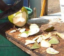 Chopping coconuts for Coco Frio in Piñones