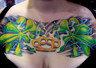 Full Color Irish chest piece tattoo with clover, brass knuckles and Celtic knot work.
