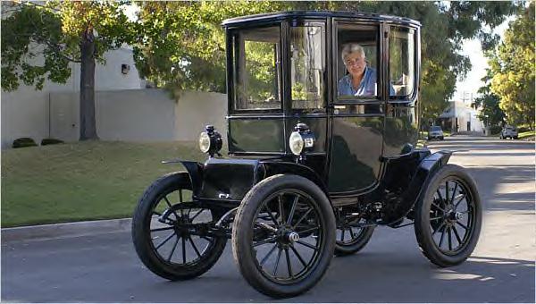 Jay Leno is known for his massive classic car collection. Here he is in his 1909 Baker Electric ~