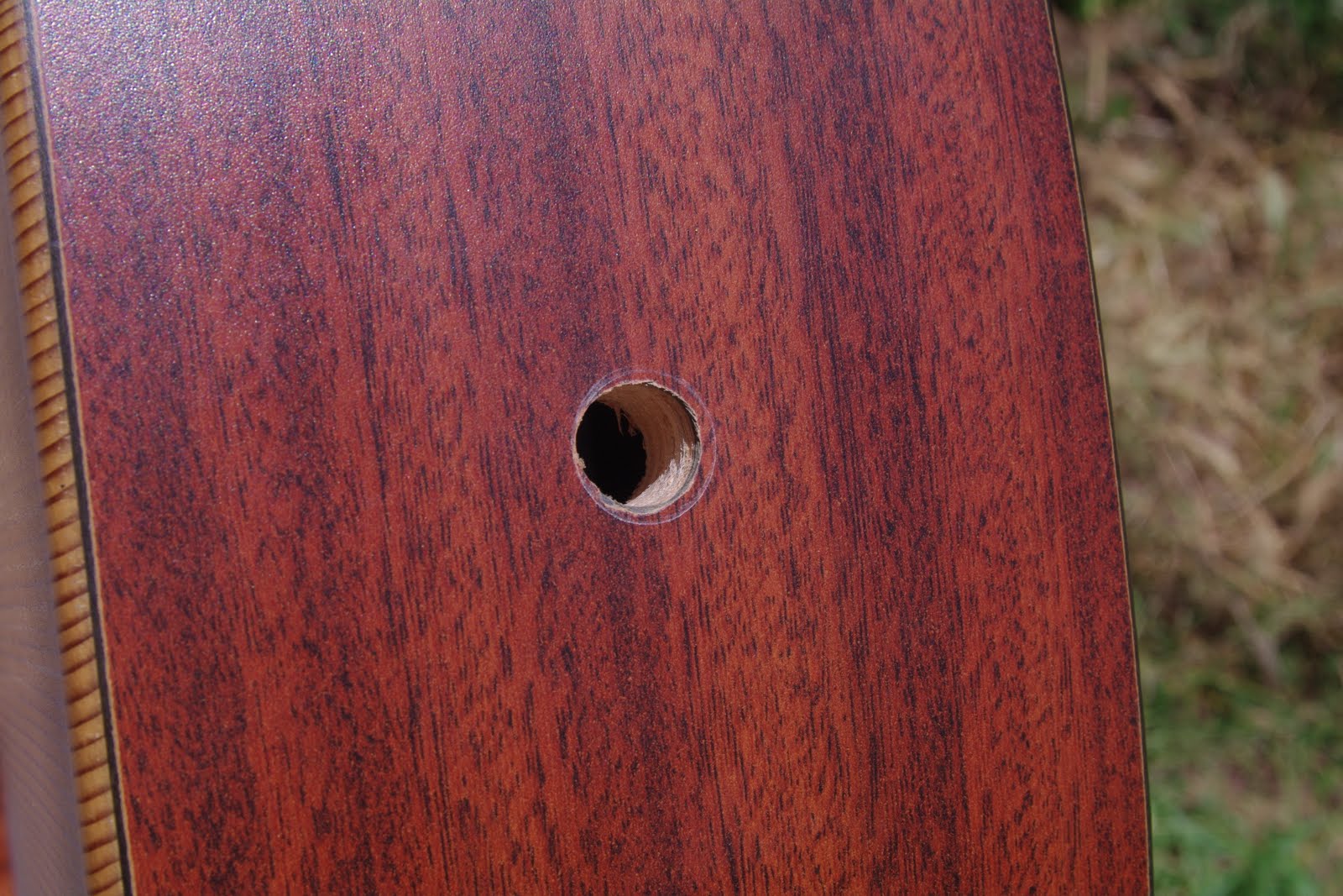 Remove the strings and drill a 1/2 inch hole in the bottom of the guitar  where the strap button is. The nice thing about the Switchcraft jack is  that it ...