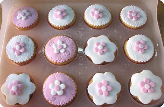Cute vanilla cupcakes decorated with homemade sugarpaste