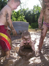 Rowdy, Hayden & Kaitlyn playing in the mud.