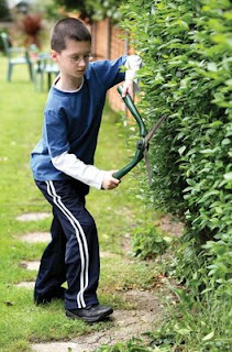 NAMC montessori students community service volunteering compassion trim hedges