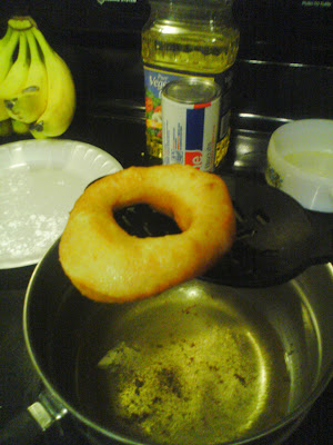 making fried doughnuts frying donuts