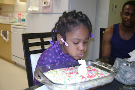 Alaina blowing out her candle!