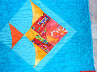 baby quilt with freehand water meander and trapunto effect