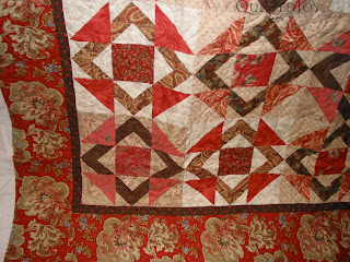 Square in a Square in reds with the Featheration Pantograph. Quilting by Angela Huffman - QuiltedJoy.com
