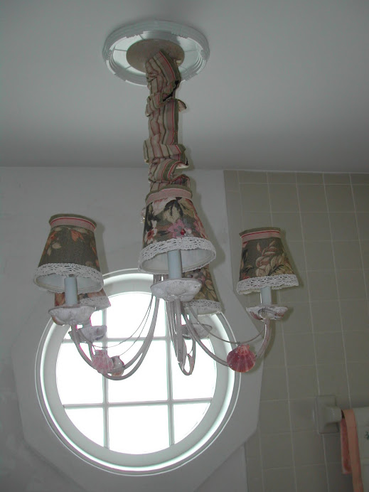 An old chandelier gets some natural decoration with shells