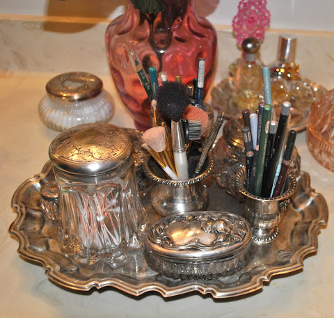 An old silver tray holds my cosmetic sundries.