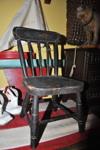 An antique doll chair