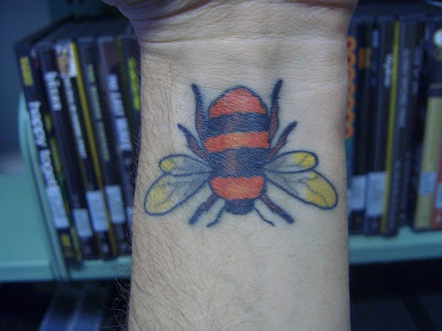 A colorful bee tattoo in the wrist. This one seems not professionally done, 