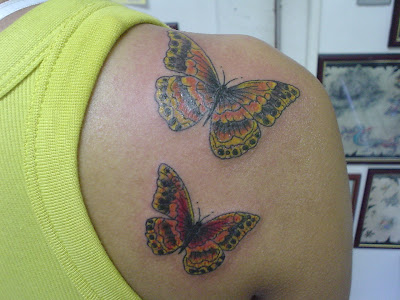 Two Lively Butterflies Tattoo at the Shoulder