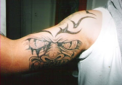 Devil Tribal Upper Arm Tattoo