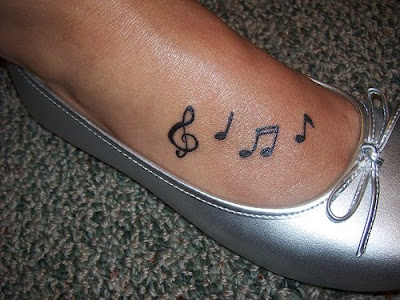 Voice music notes tattoos on feet