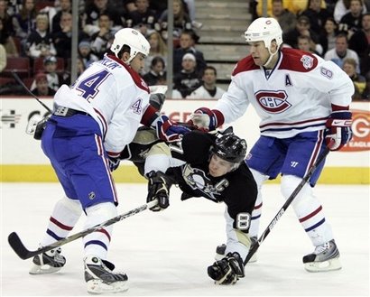 [capt_a1a3cec243114484ac224fb198883f20_aptopix_canadiens_penguins_hockey_paks103.jpg]