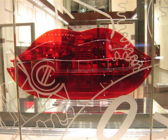 Red lips on 57th Street at Tag Heuer