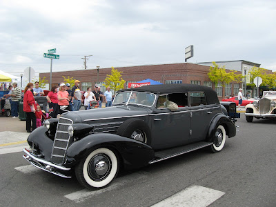 This 1934 Cadillac 4door convertible is being driven by its owner 