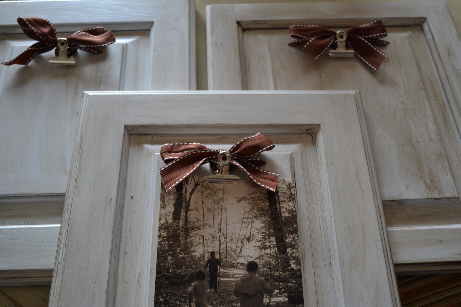 Thrifty Decorating Cupboard Door Picture Holders
