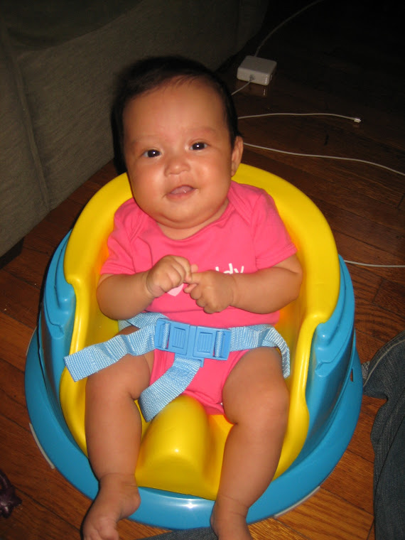 Sitting in my Bumbo chair!