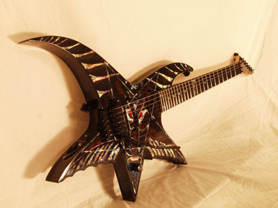 http://3.bp.blogspot.com/_IUYlNU10BMY/SoUOophlJkI/AAAAAAAAg64/dUwm-AcU22k/s400/strange-guitars-05.jpg