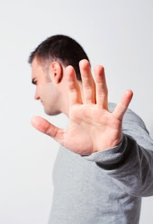 Forget it! (Photo: iStock/pcatalin) Man holding up hand to say stop