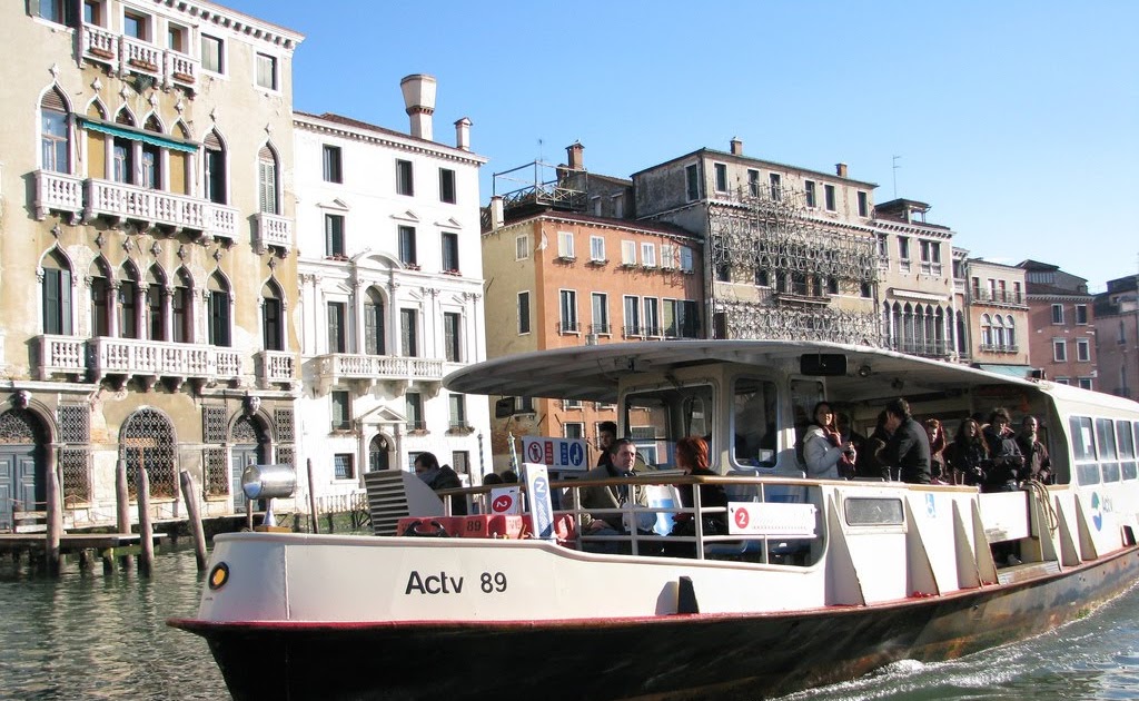 Venice, Italy- February 26th, 2011: Image Of A Vaporetto Reaching The  Zattere Station On The Grand Canal In Venice During The Carnival Days.  Vaporeto Is A Motorised Waterbus Which Ply Regular Routes