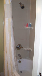 a shower curtain and a shelf
