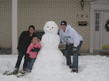 A Snowman on Christmas day.  Uncle Danny and Aunt Jessica helped Savannah.