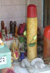 collection of phalluses, cambodian road shrine