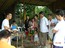 Moises Gonzales asks candidates for their confessions before baptism on Nov.22