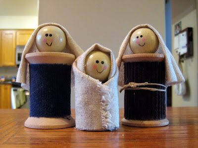 Thread spools made into dolls of Jesus, Mary, and Joseph.